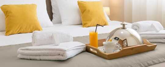 Breakfast served on a hotel bed