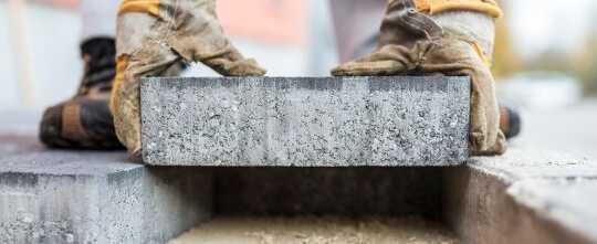 Builder Laying Outdoor Paving Slabs