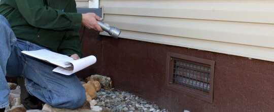 Home inspector checking the foundation