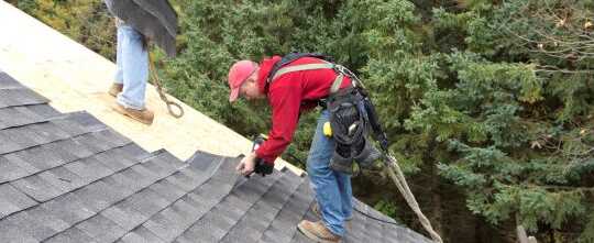 Roofers Installing Asphalt Shingles